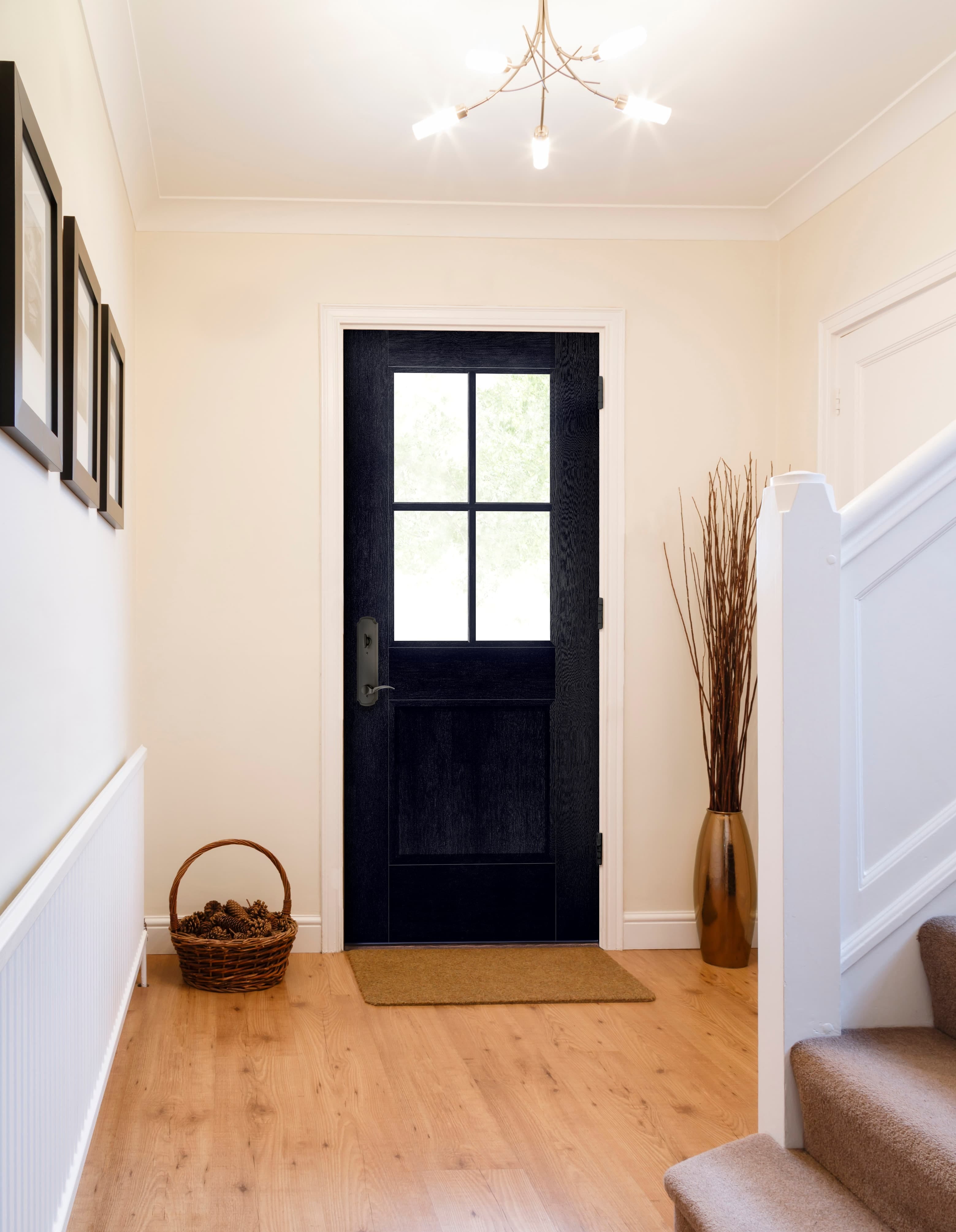 Black Front Door With Modern Farmhouse Details Black front door with classic grilles in farmhouse style entry