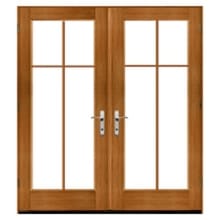 Cross Double wooden French doors with divided glass panels and metal handles in an oak finish