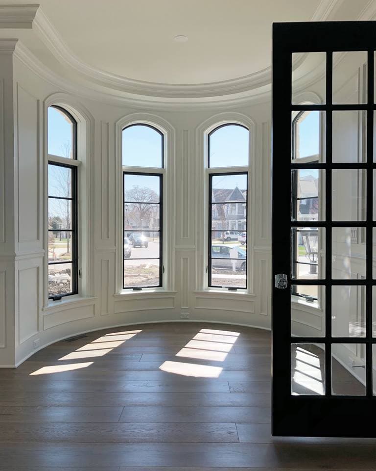 Arch Top Casement Windows Illuminate Circular Room Arch top casement windows fit in round shaped room
