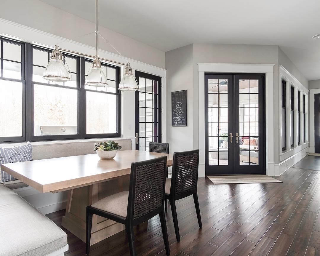 Black Windows & Doors Complement Contemporary Breakfast Nook double-hung windows and french doors bring light into contemporary breakfast nook