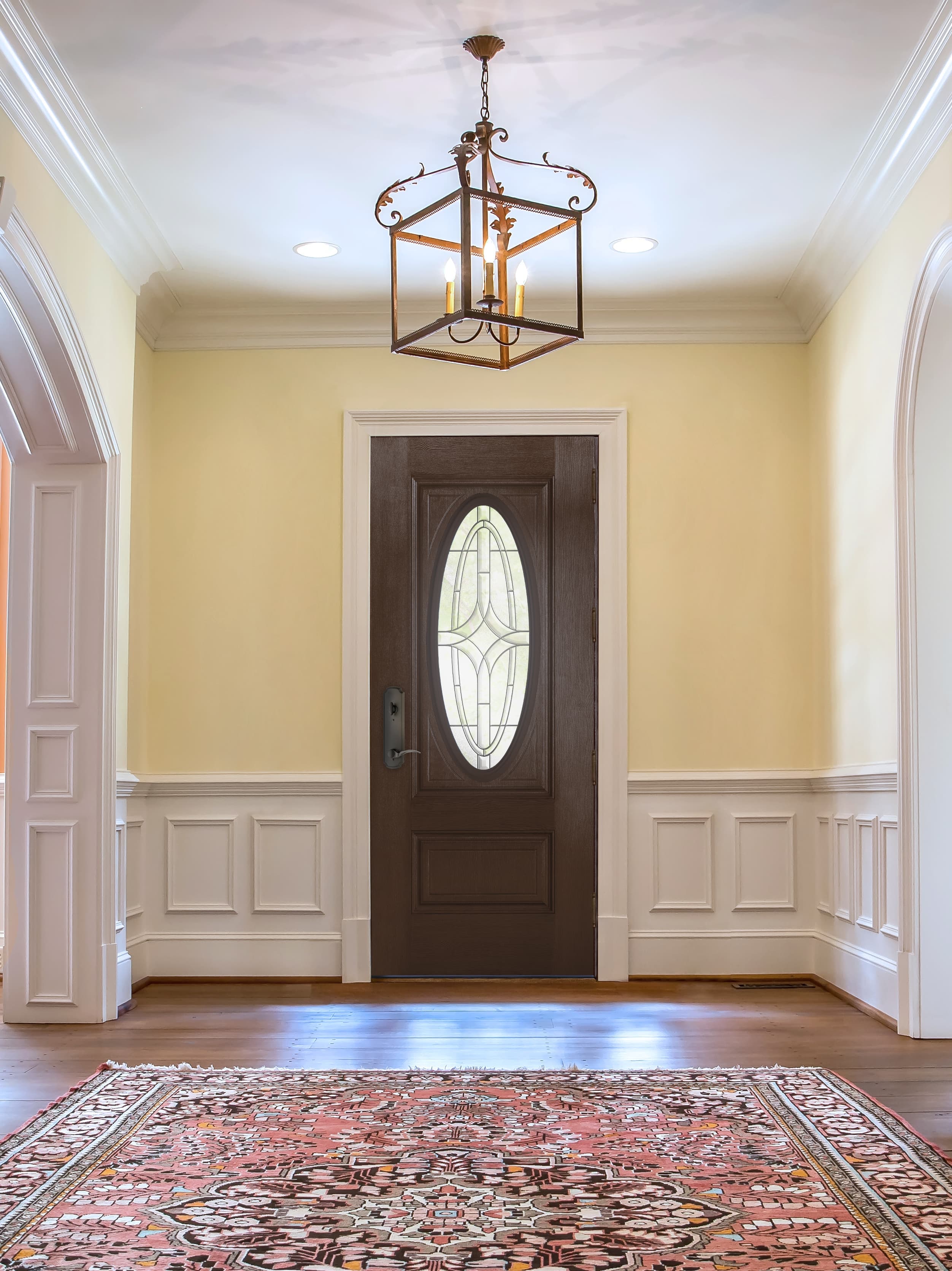 Front Door With Ornate Glass Creates Elegant Entryway Brown front door with ornate glass in elegant entryway