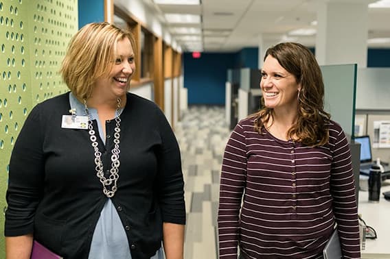 two pella employees collaborating