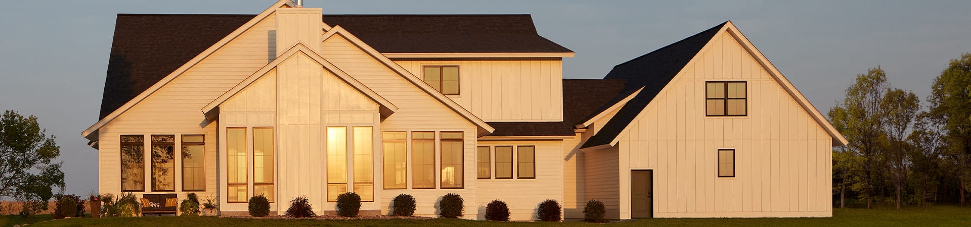 exterior home in the evening with pella fiberglass windows