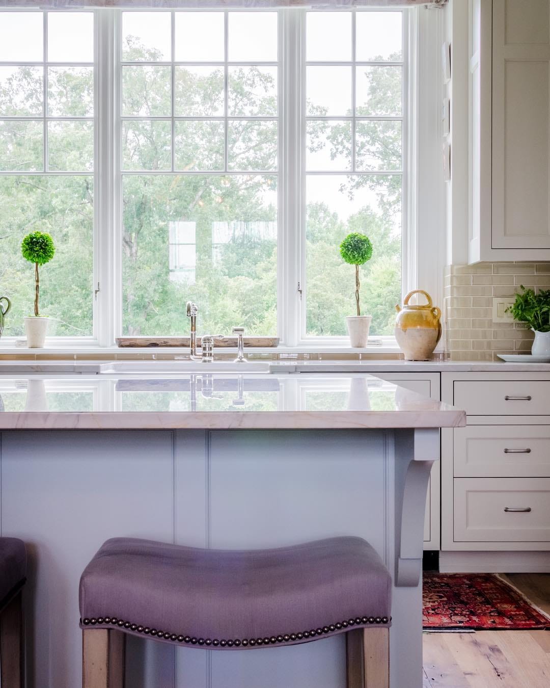Unique Grille Pattern Featured In Traditional Kitchen casement window with traditional grille pattern over sink in white on white kitchen