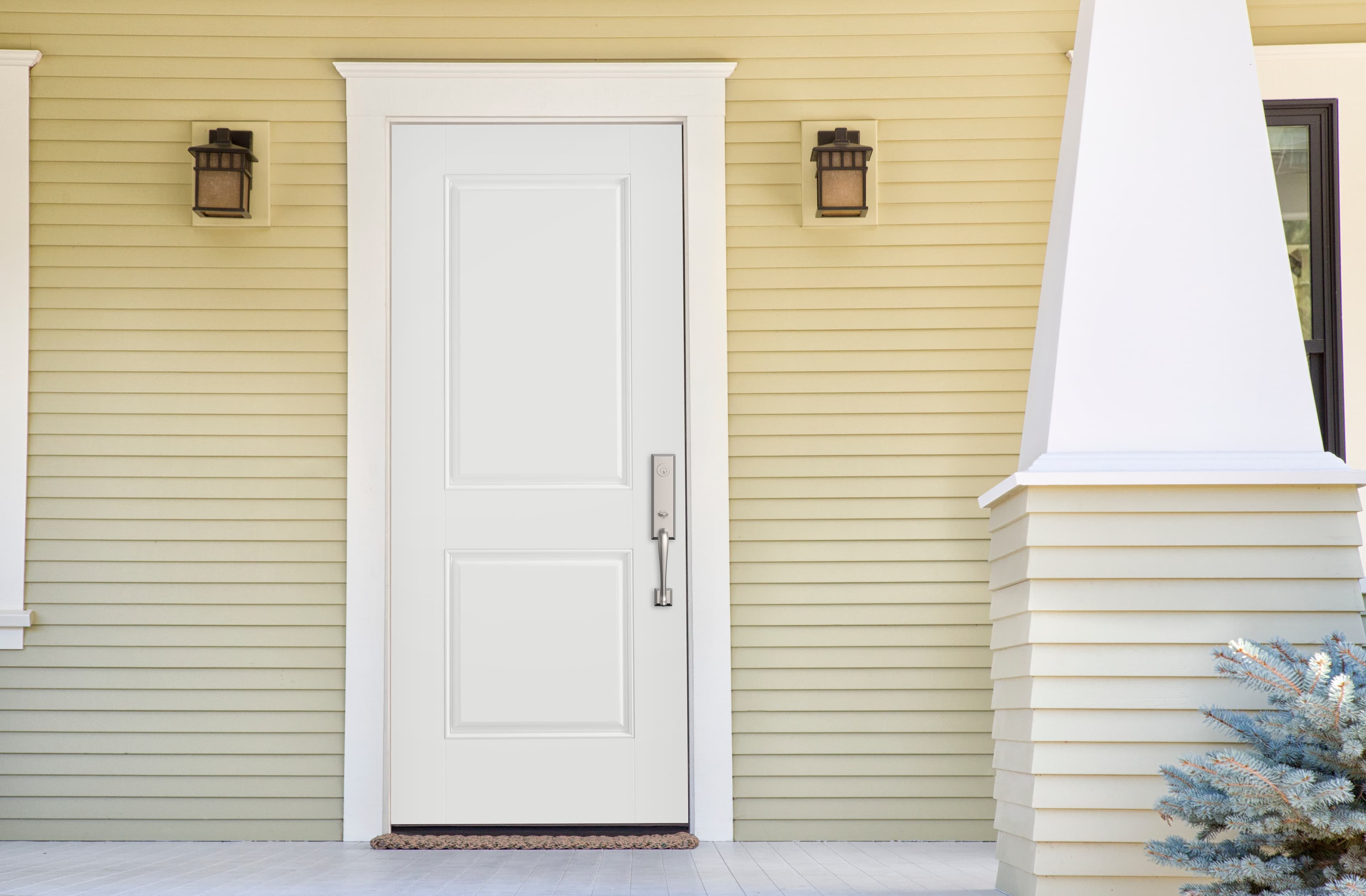Solid Steel Door Brings Strength, Durability, and Style Stylish steel door surrounded by traditional trim and clapboard siding