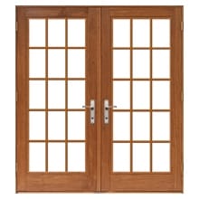 Traditional lifestyle hinged patio door with traditional grilles