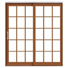Traditional lifestyle sliding patio door with traditional grilles