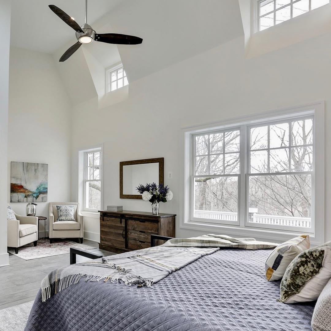 Bedroom Windows Provide Light & Architectural Intrigue White bedroom with windows placed high near the ceiling to let in lots of light