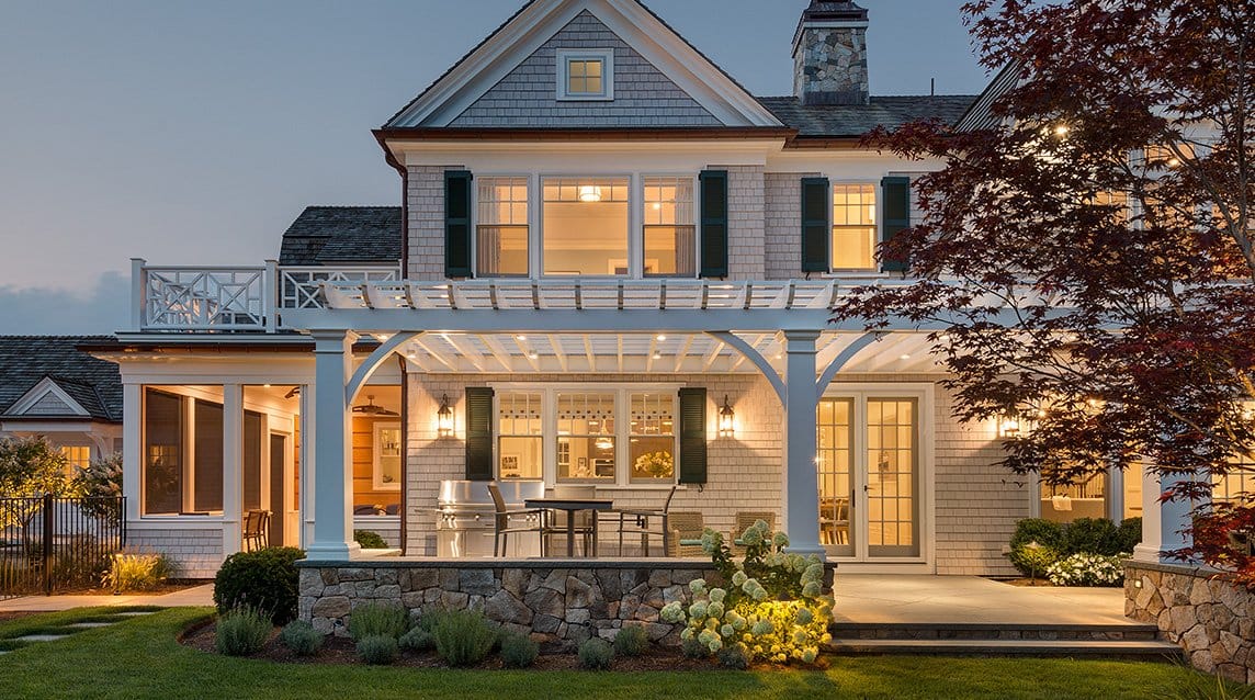 Backyard view of house with various types of windows
