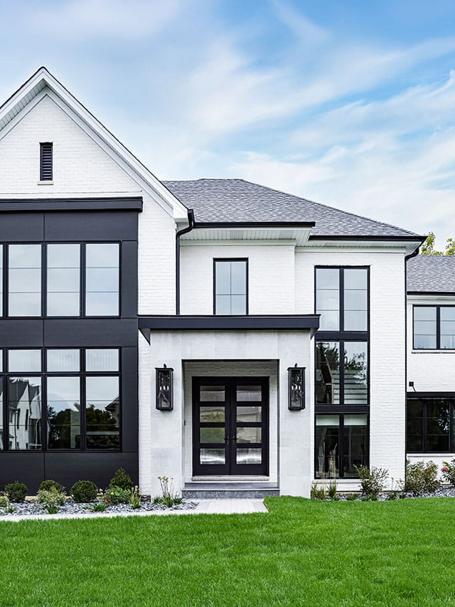 Modern home entry with black windows, clean lines, and contemporary exterior detailing.