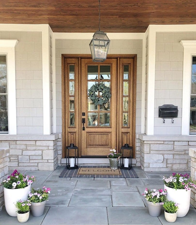 Natural Wood Front Door Ties Together Modern Farmhouse Style Entryway with a farmhouse style natural wood front door with sidelights on either side