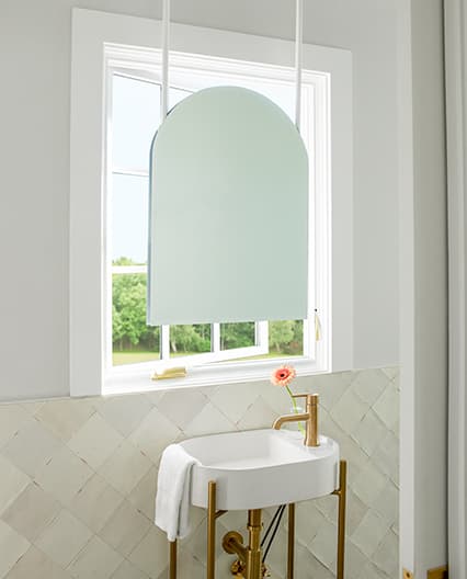 White casement replacement window in bathroom.