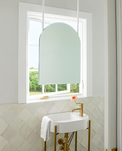 White casement replacement window in bathroom.