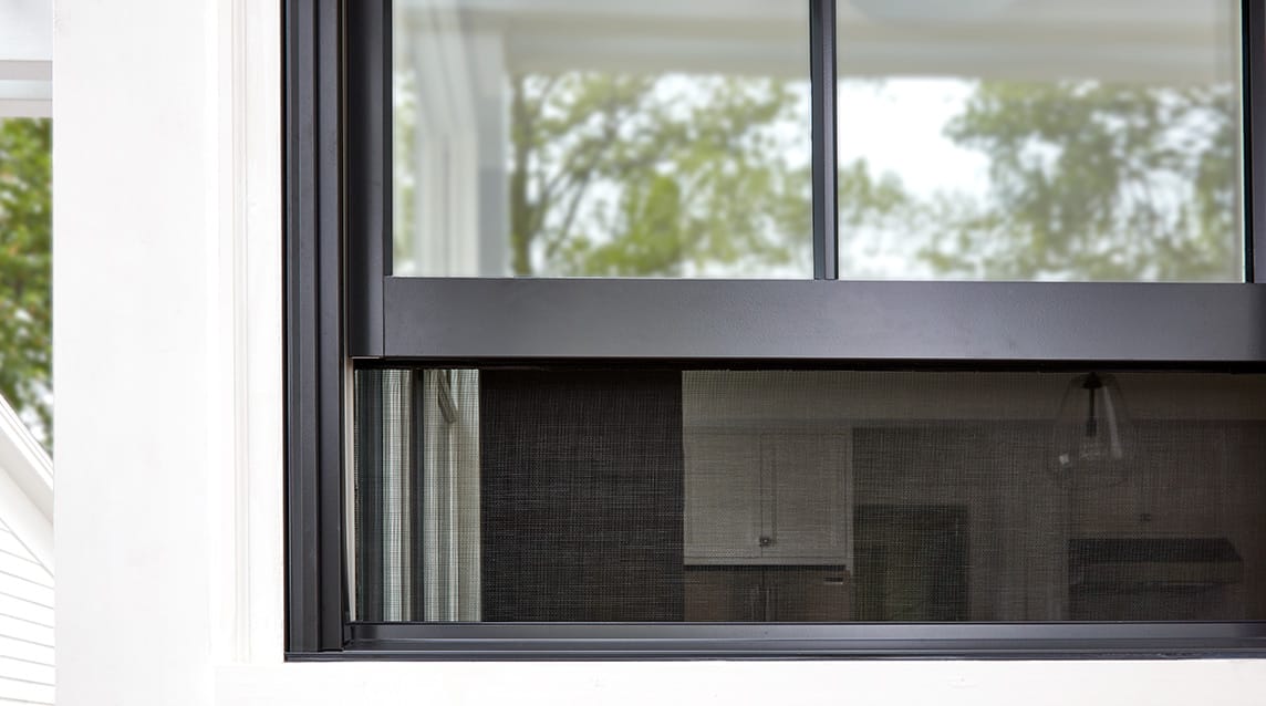 Integrated rolscreen on white house.