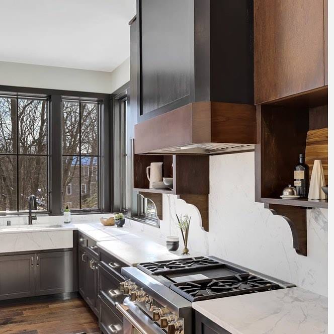 Black Windows & Wood Cabinets In Modern Kitchen white kitchen walls are contrasted by black windows over the sink and wood cabinets over the stove