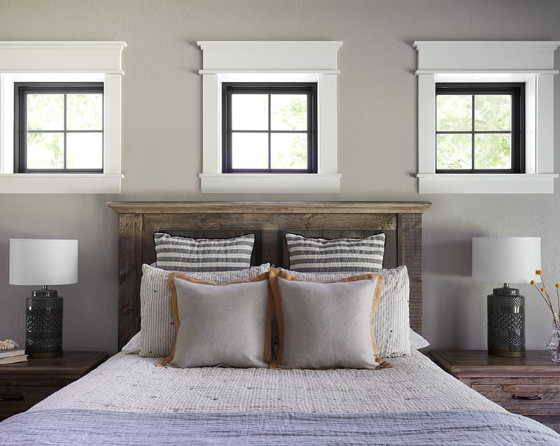 three black windows with white trim bedroom