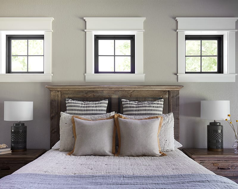 three black windows with white trim bedroom