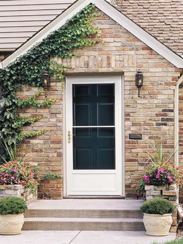 white storm door on blue front entry door