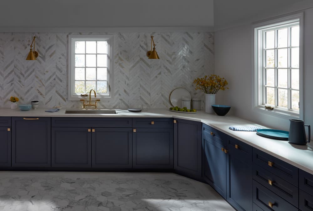 White Casement Windows Brightens Kitchen With Navy Cabinets White kitchen casement windows with traditional grille pattern paired with navy cabinets