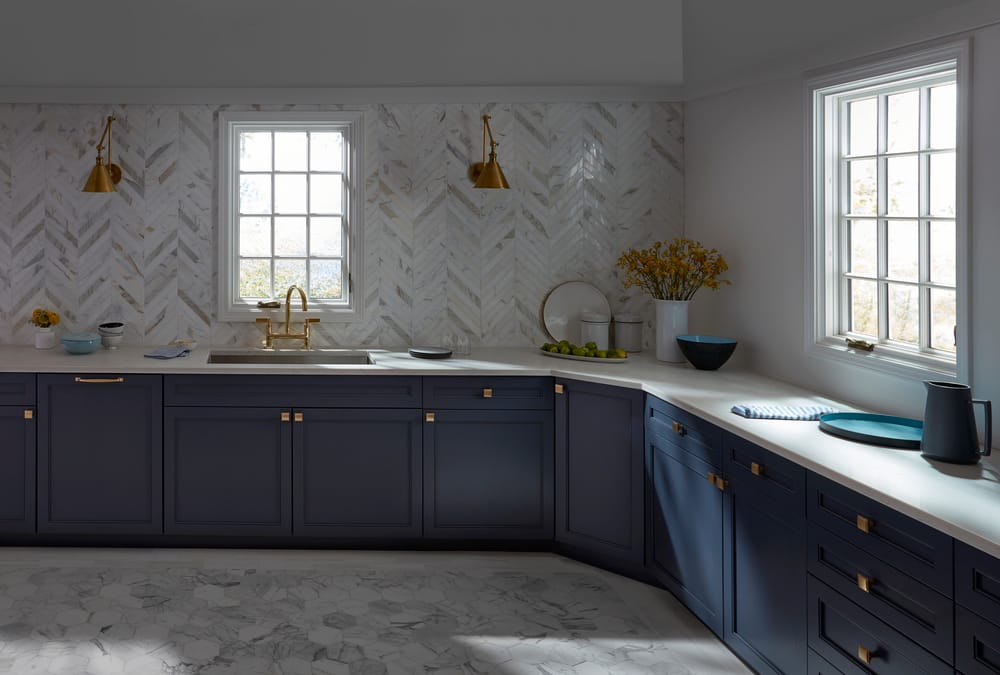 White Casement Windows Brightens Kitchen With Navy Cabinets White kitchen casement windows with traditional grille pattern paired with navy cabinets