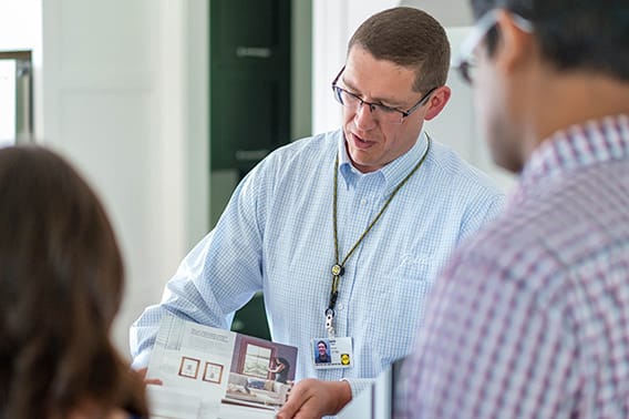 Pella Employee Passing out Sales Documents
