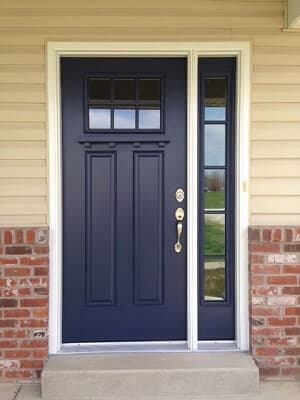 Craftsman Style Front Door In Blue Provides Light & Privacy Navy blue craftsman style front door with attached sidelight on the right hand side