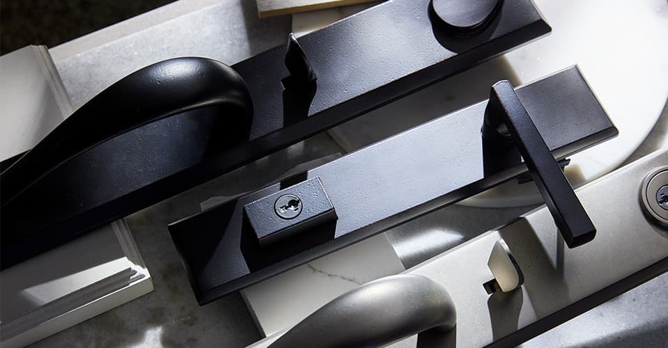 collection of patio door hardware in multiple finishes