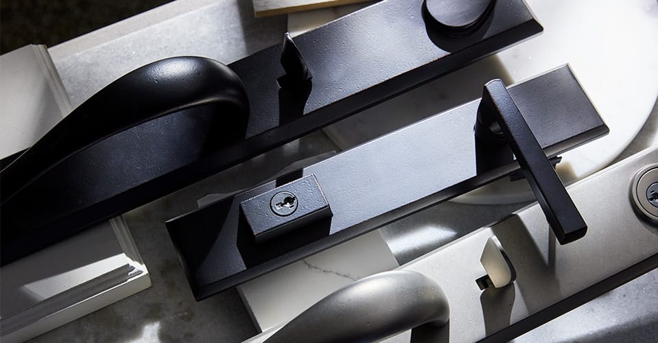 collection of patio door hardware in multiple finishes