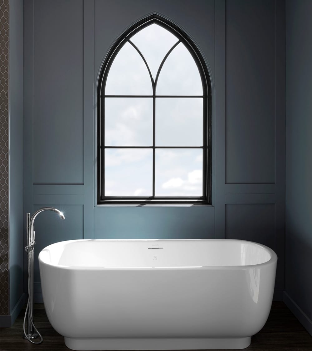 Custom Gothic Style Window Elevates Bathroom Design dark gray bathroom walls, white freestanding tub, and black custom shape window overhead