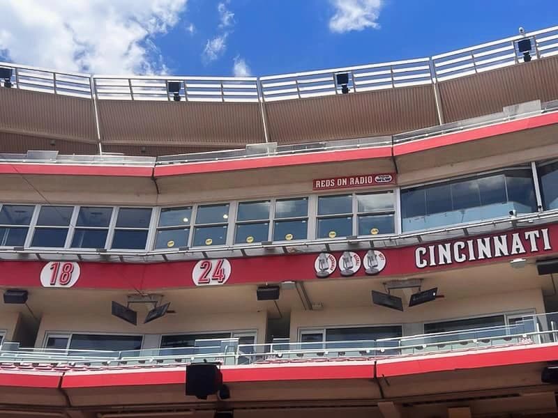 Cincinnati Reds Radio Booth with large windows and red signage at the stadium.