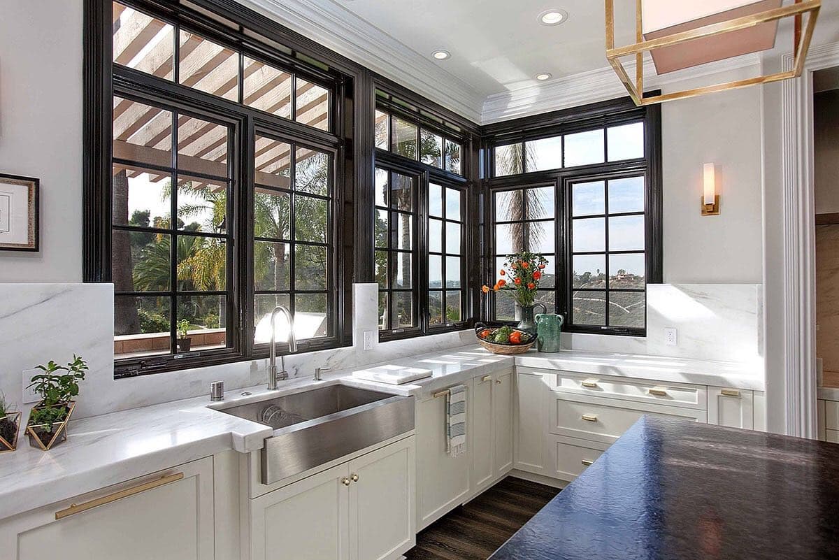 Black Windows With Black Trim Creates A Bold Focal Point Black windows with black trim in white kitchen