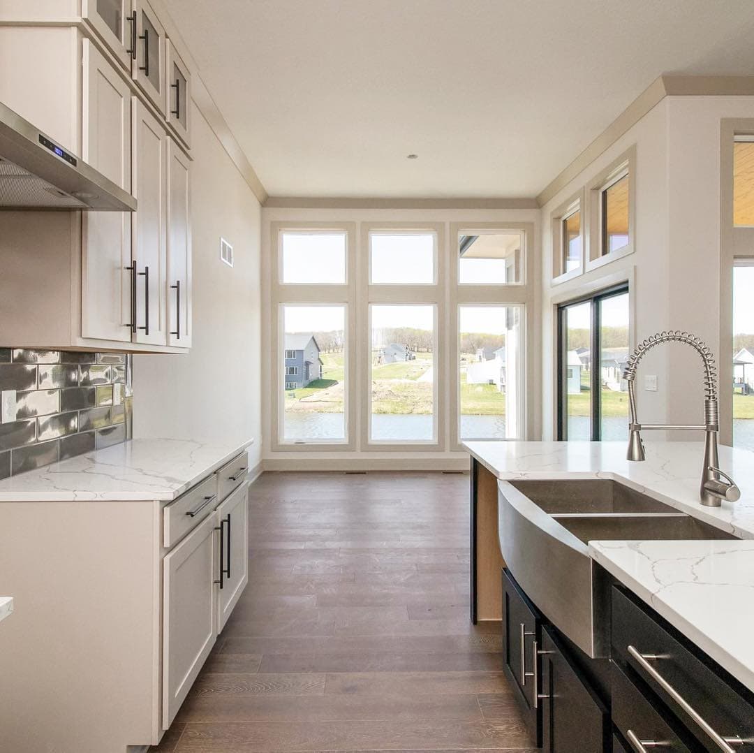 Floor-To-Ceiling Windows Make Narrow Kitchen Feel Bigger Narrow kitchen looks bigger with floor-to-ceiling casement windows