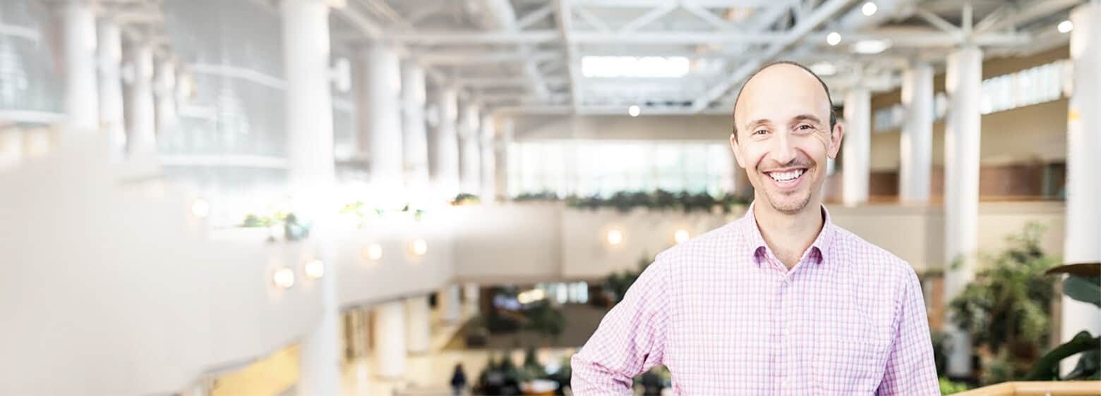 man standing in pella corporation atrium