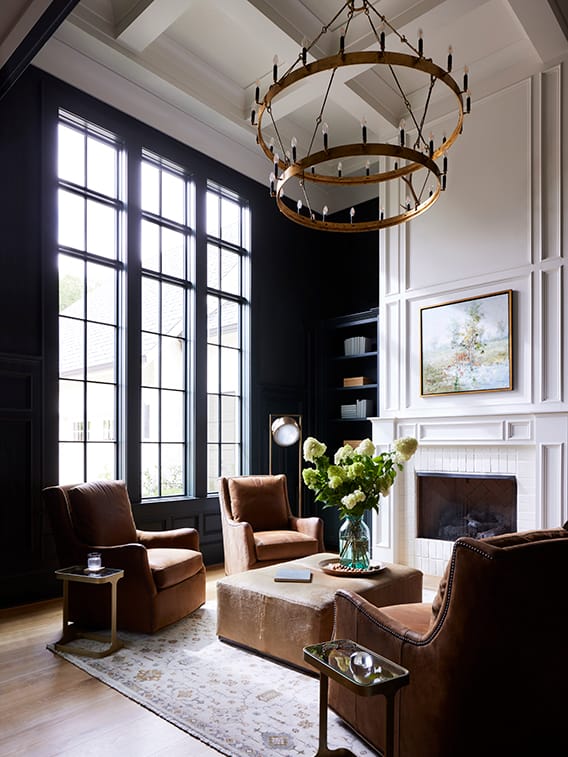 Formal living room with victorian windows featuring a traditional grille pattern.