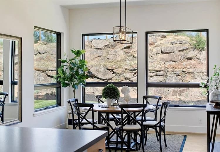 Black Windows Provide Crisp Contrast To Modern Dining Room Dining room in Santa Rosa home with newly installed Pella contemporary wood windows.