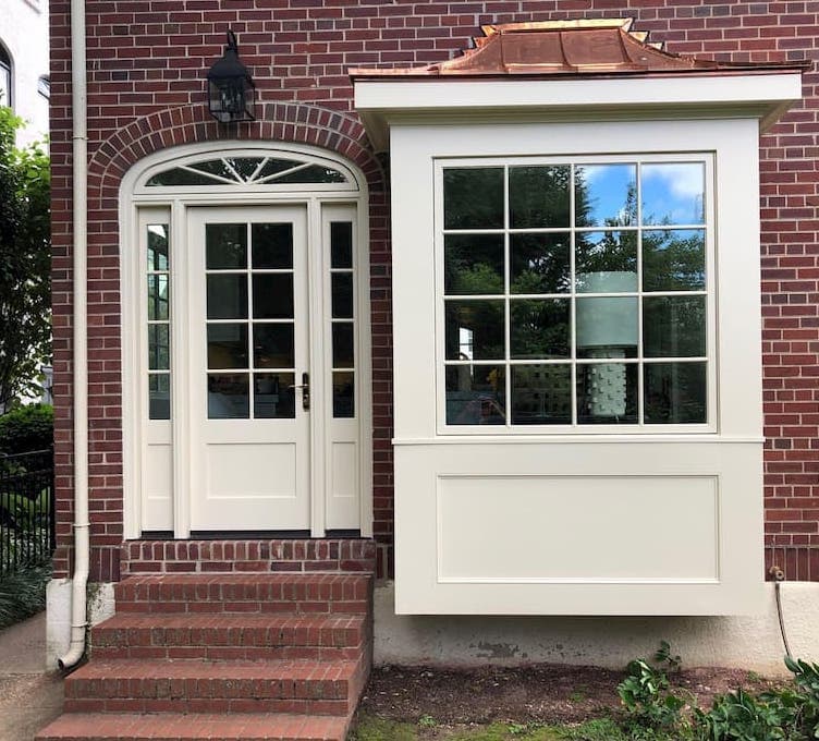 Authentic Details & Modern Innovation for Custom Entry Tan picture window and custom hinged patio door with sidelights and transom on brick home
