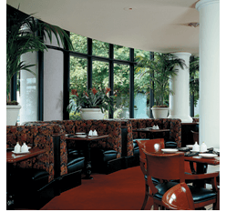 a curved wall with windows installed through horizontal ribbons