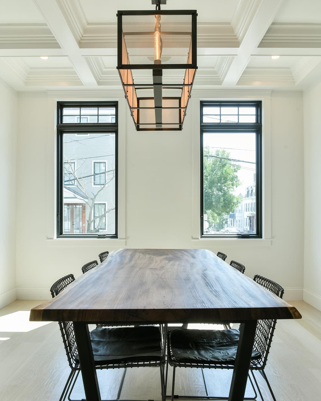 Black Windows Tailor Made For Contemporary Dining Room Contemporary dining room brightened by two casement windows with small fixed windows overhead