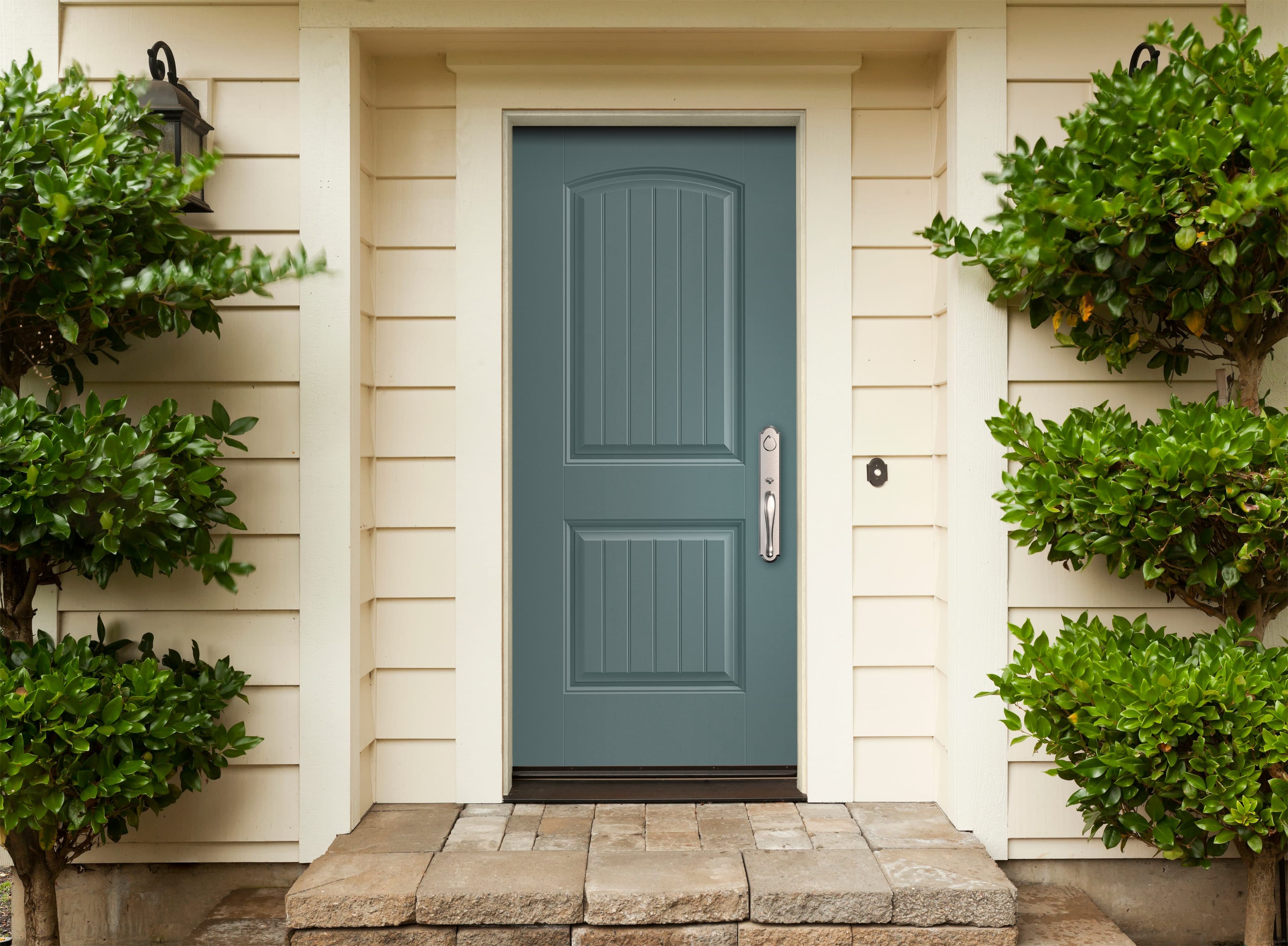 Blue Front Door Is The Jewel Of This Entryway Blue front door with farmhouse plank panels and silver hardware