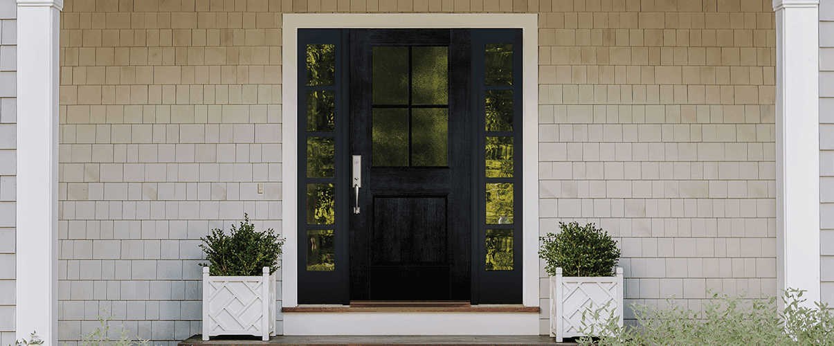 wood entry door with 2x4 grilles and 1/4 light sidelights