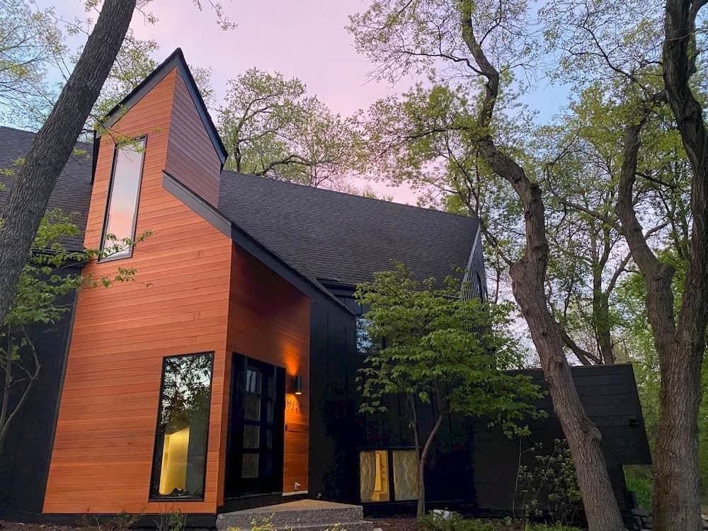 Minnetonka modern home with newly installed black windows.