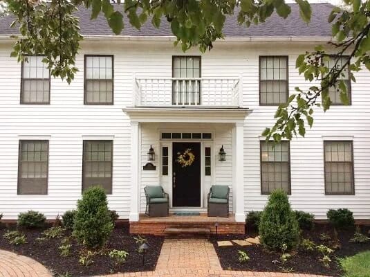 Front view of traditional Columbus home with outdated windows.