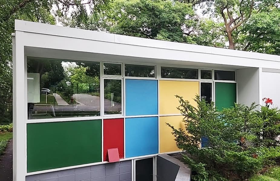 Mid-century modern home in Falcon Heights with color panels and energy-efficient windows.