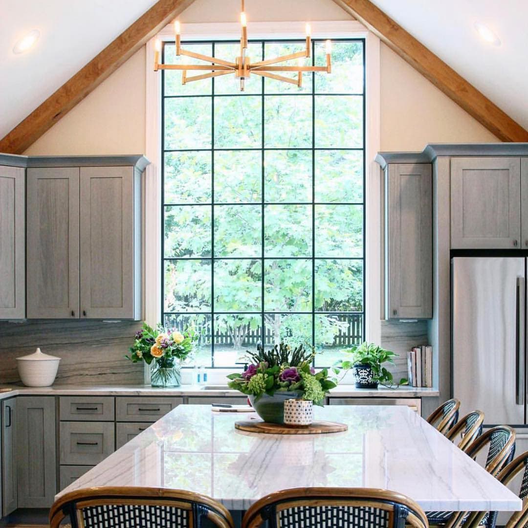 Large Picture Window Brings Natural Light Into Kitchen farmhouse style kitchen sink with large picture window