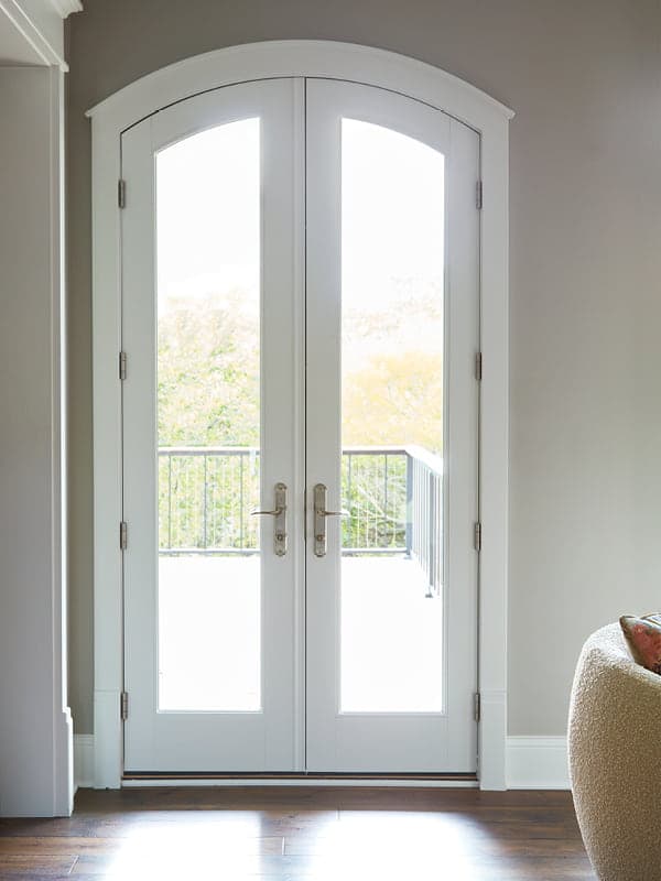 Arched white two panel hinged patio door reserved series