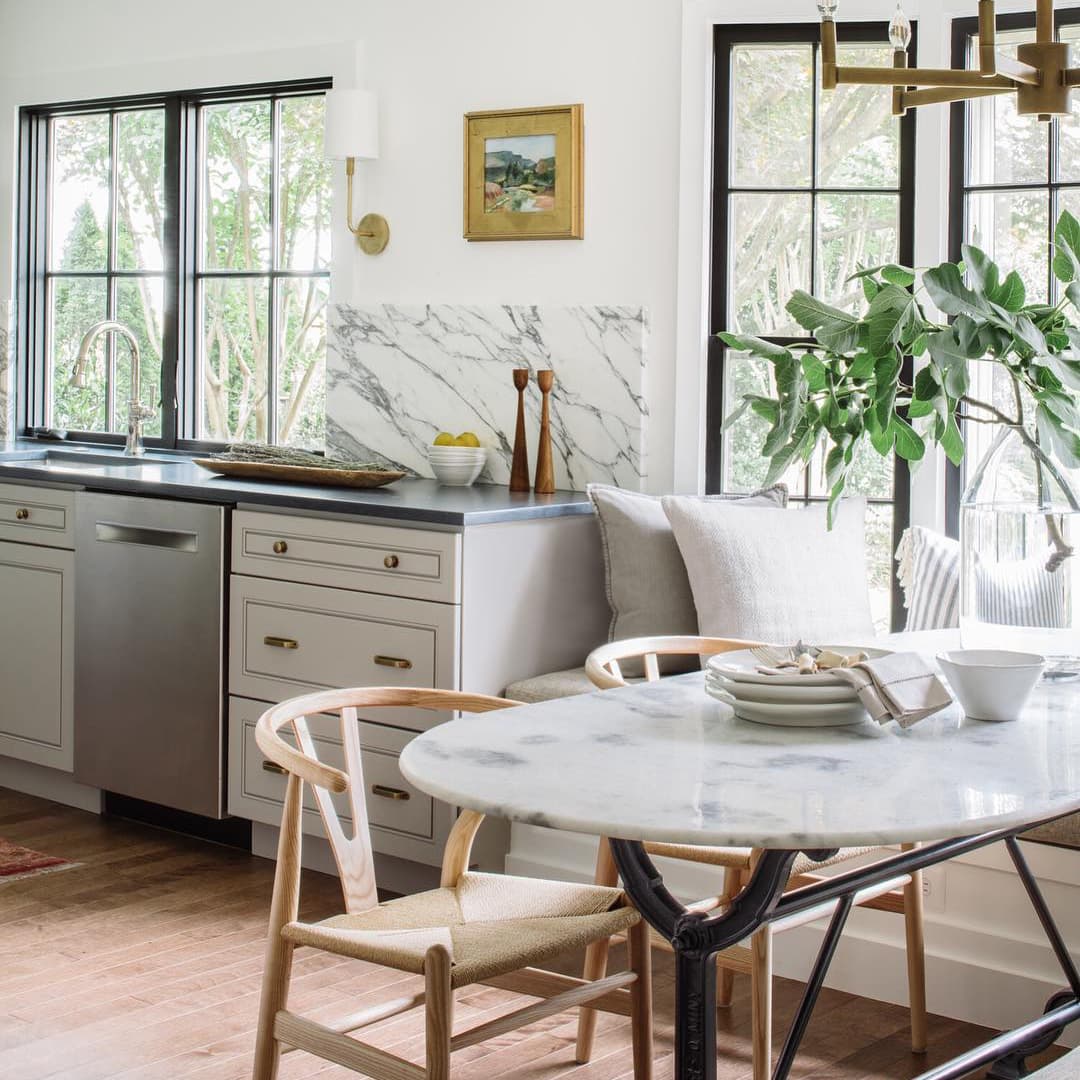 Single-Hung Black Windows In Kitchen Breakfast Nook Black frame windows let light in to kitchen breakfast nook