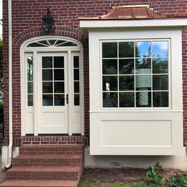 virginia home with custom door configuration with transom and sidelights