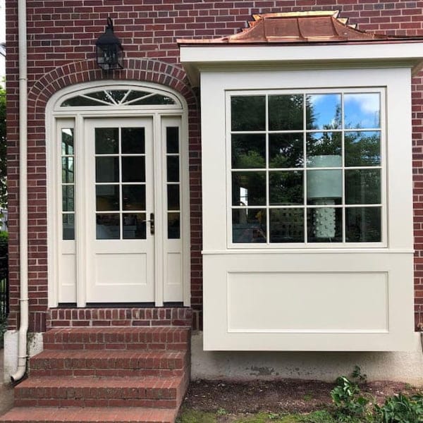 virginia home with custom door configuration with transom and sidelights