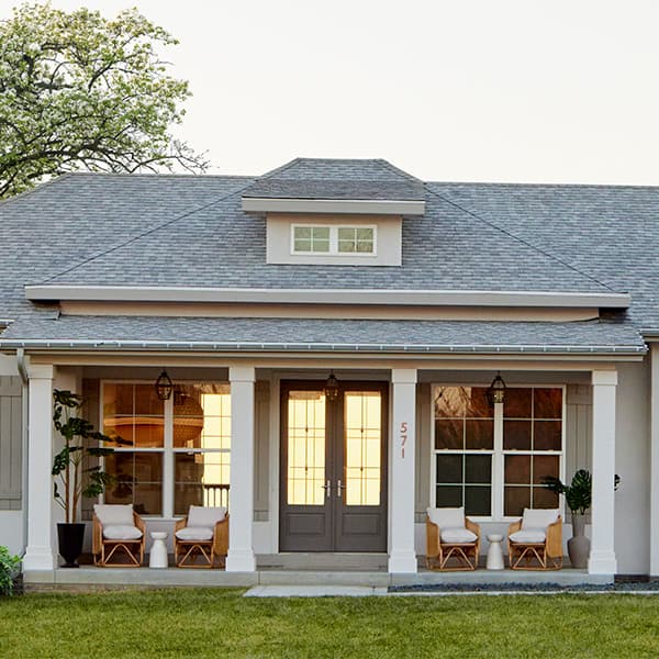 a coastal home with a hipped dormer window