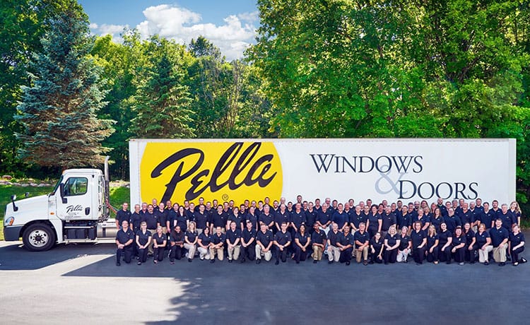 Minnesota's team members all outside in front of a Pella truck.